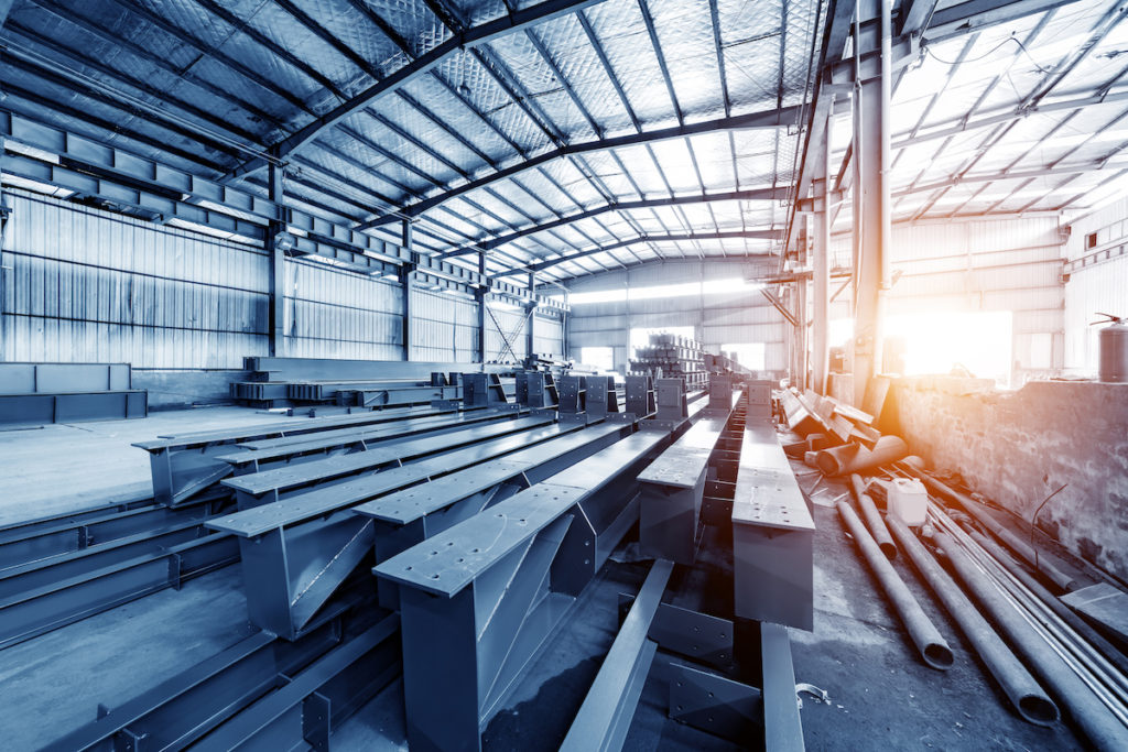 Steel factory floor, stacked with a lot of steel